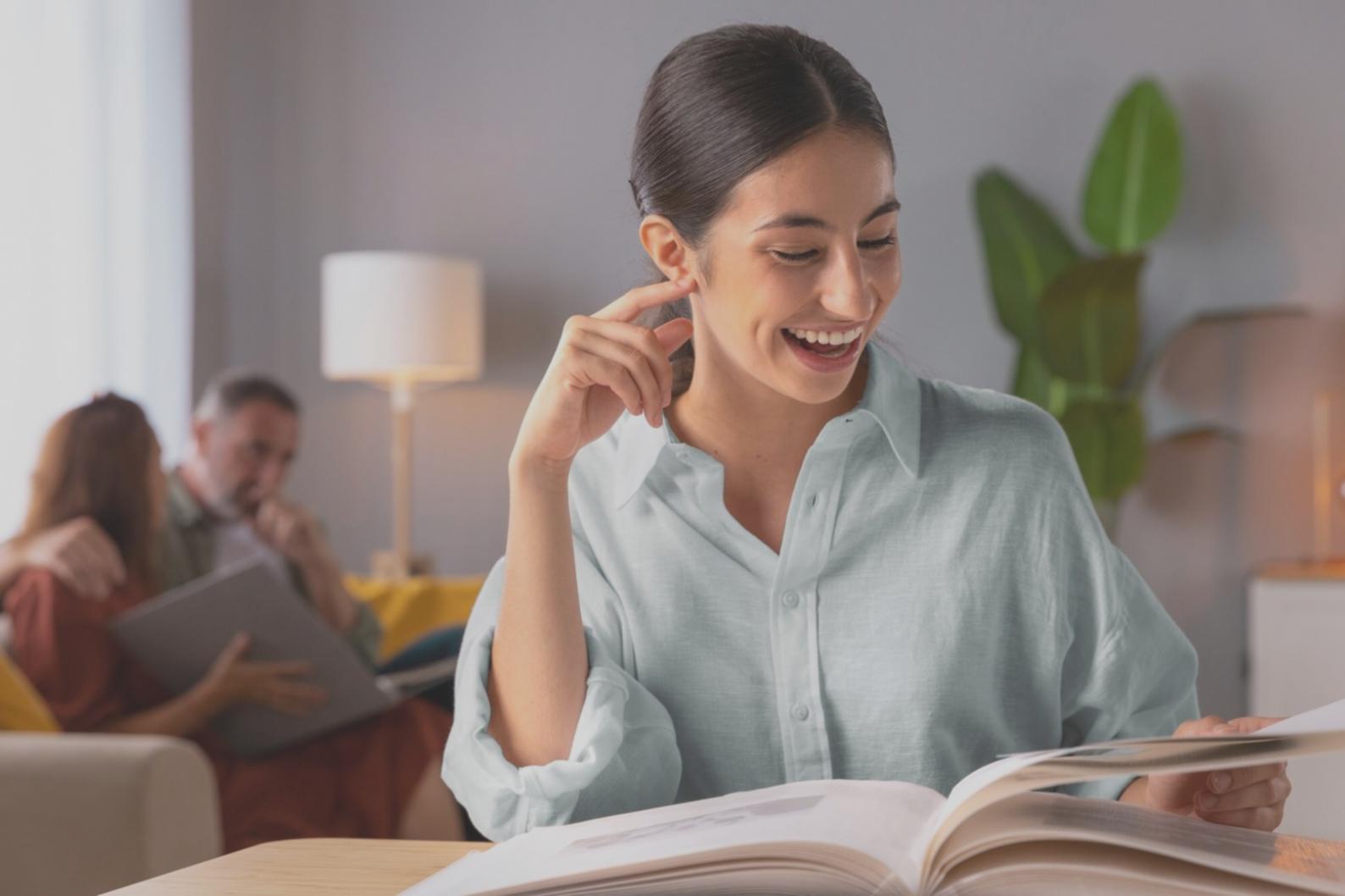 Person reviewing personal budget on laptop with notebook